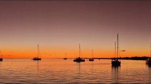 a boat is docked next to a body of water