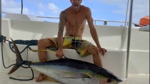 a man holding a fish