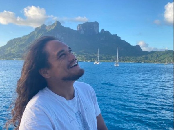 a person standing in front of a body of water