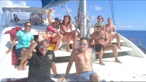 a group of people on a boat posing for the camera