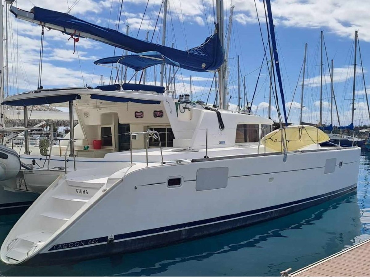 a boat is docked next to a body of water