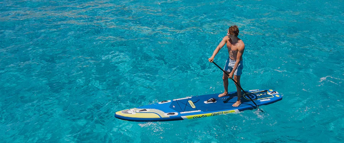 a man riding a wave on a surf board on a body of water