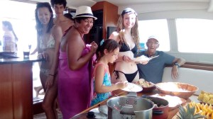 a group of people sitting at a table with a plate of food